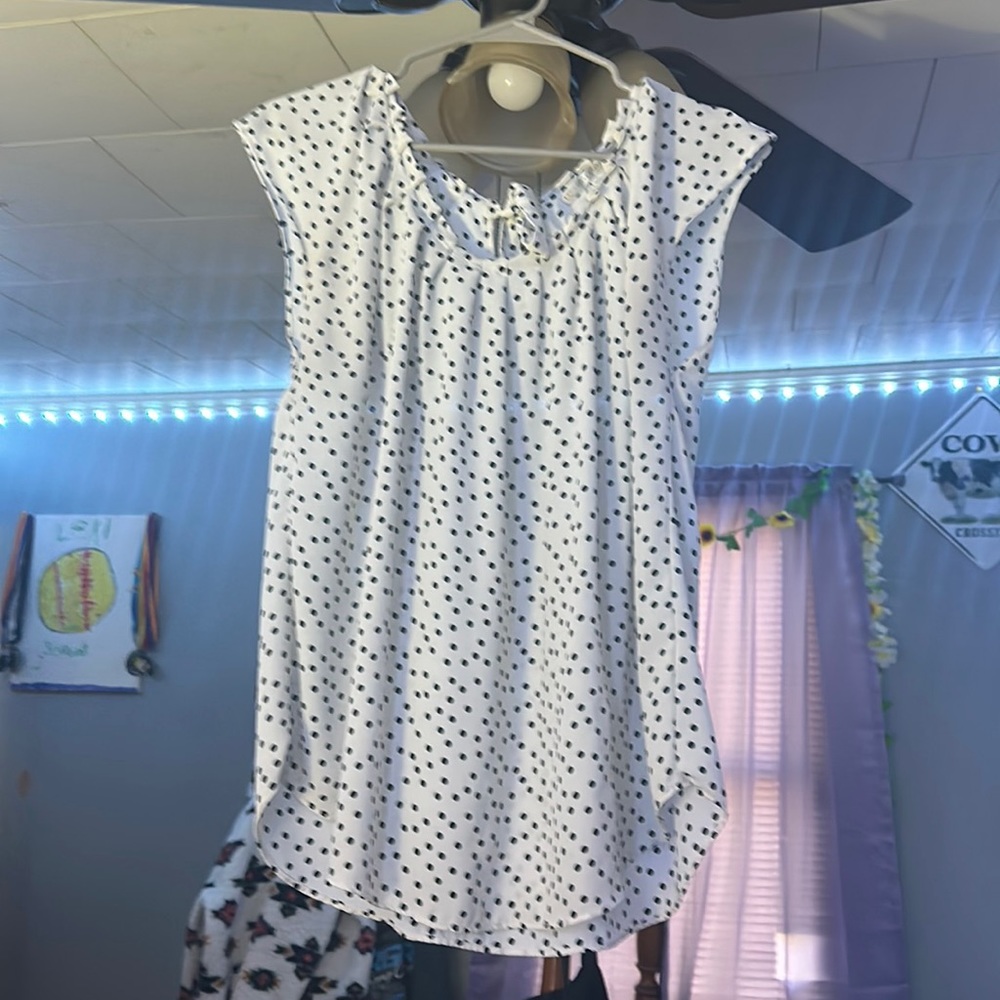 This is a wonderful polkadot shirt,it is a XL but fits kinda small.